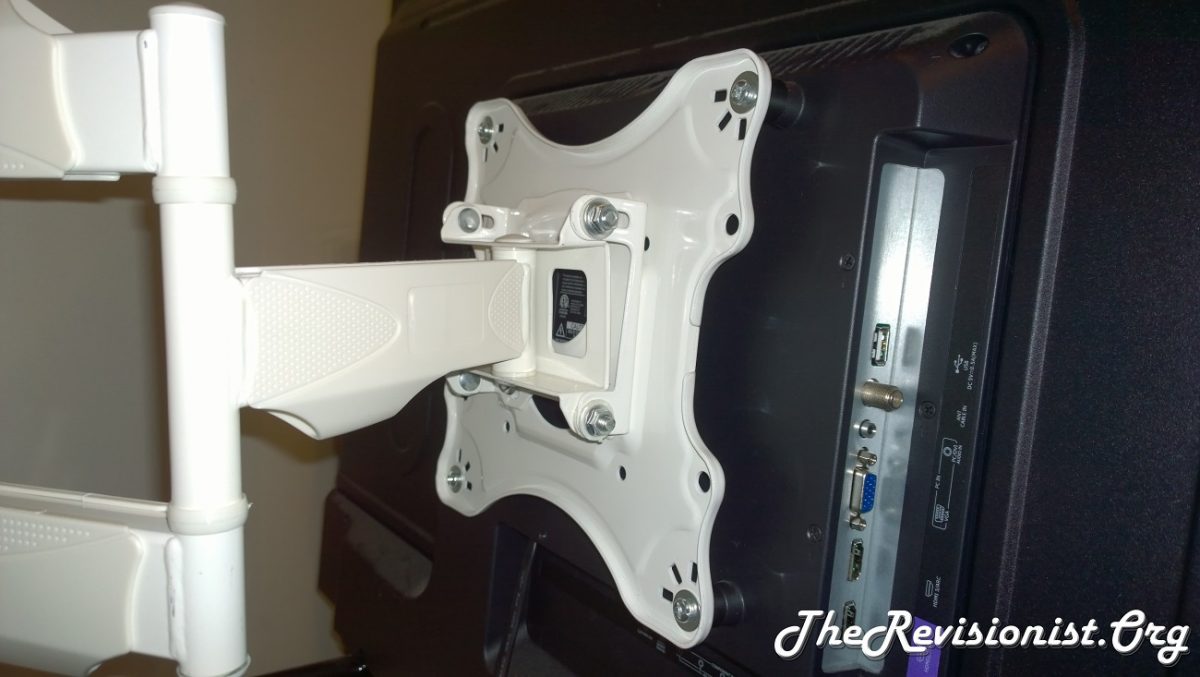 TV Display mounted to wall with Onkron M4 arm